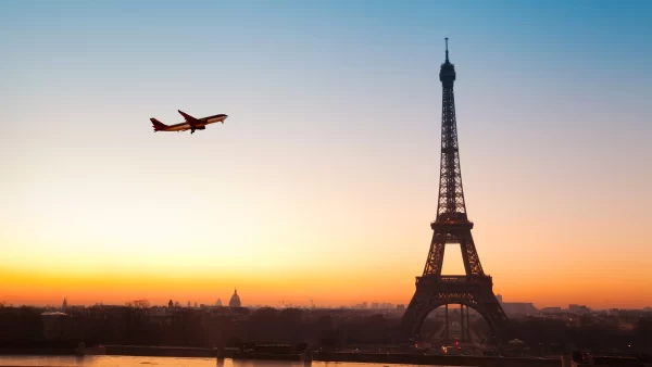 A plane flying over the Eiffel Tower, Paris