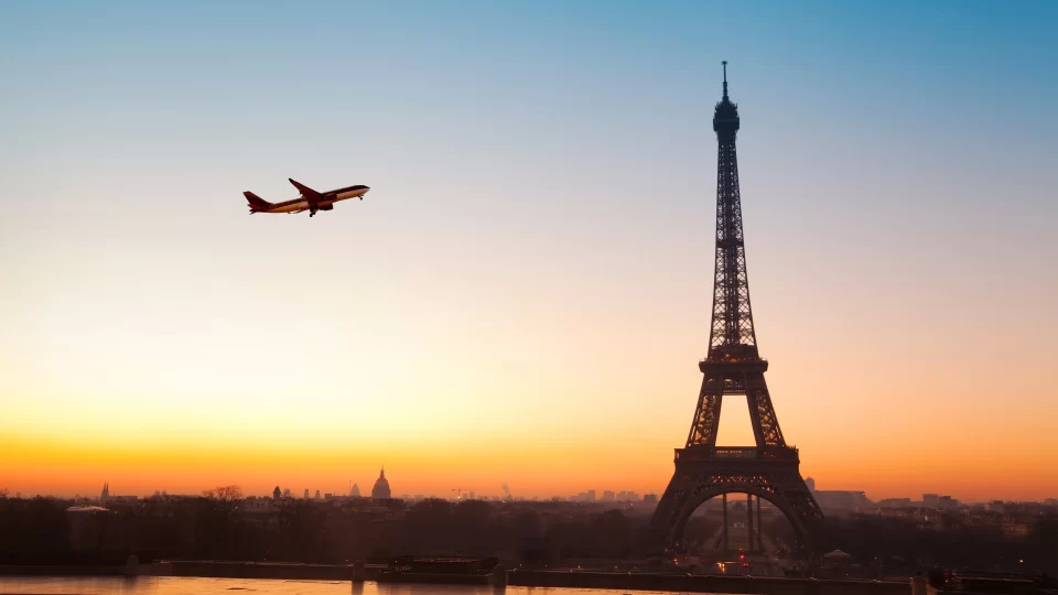 A plane flying over the Eiffel Tower, Paris